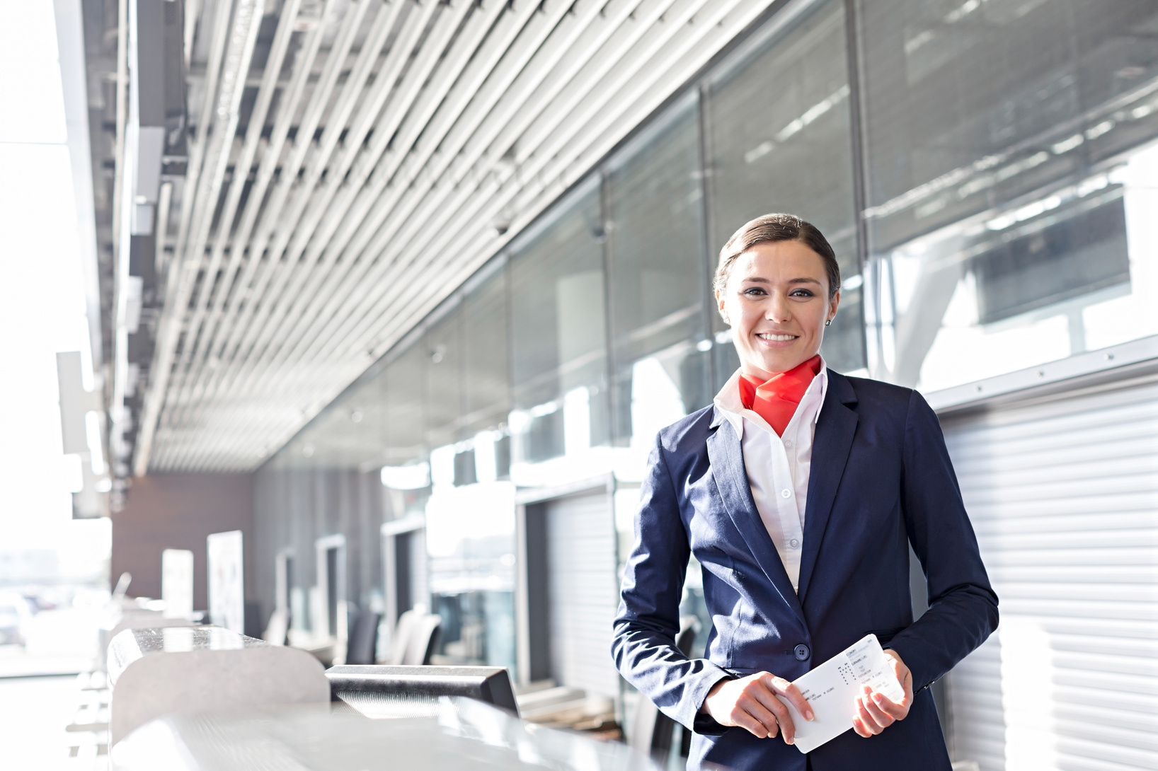 Passenger Service Agent Holding Boarding Passes 
